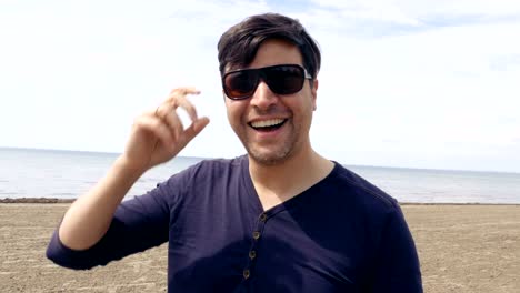 Man-Smiling-on-a-Beach