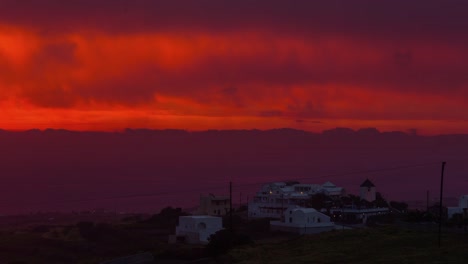 sunset-night-illumination-santorini-island-fira-town-mill-top-panorama-4k-time-lapse-greece