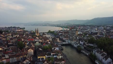 switzerland-sunset-time-zurich-cityscape-central-riverside-aerial-panorama-4k