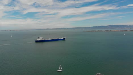 Drone-Shot-of-a-Commercial-Ship-Traveling-Across-the-Bay-in-San-Francisco,-California