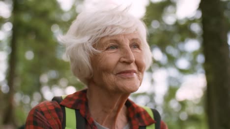 Senior-Female-Hiker-Enjoying-View-of-Forest