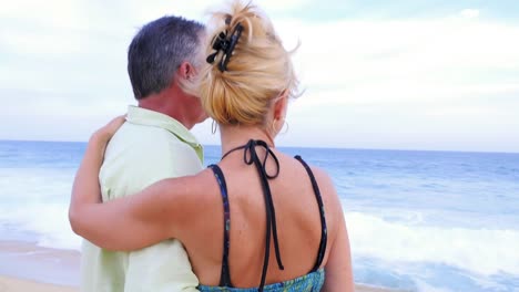 An-older-couple-looking-out-at-the-ocean