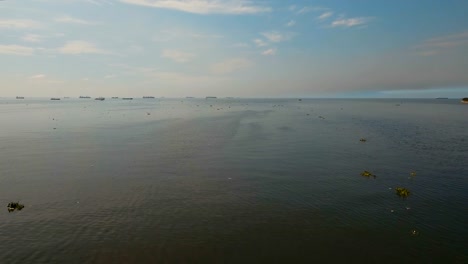 Aerial-Cargo-ships-anchored-in-the-sea.-Philippines,-Manila