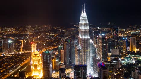 Time-Lapse---Nightscape-at-Kuala-Lumpur-City.-High-Angle/Aerial-View.-Petronas-Towers-Visible.