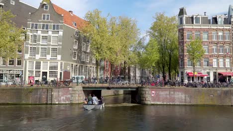 Group-of-people-riding-the-boat-cruising-the-canal