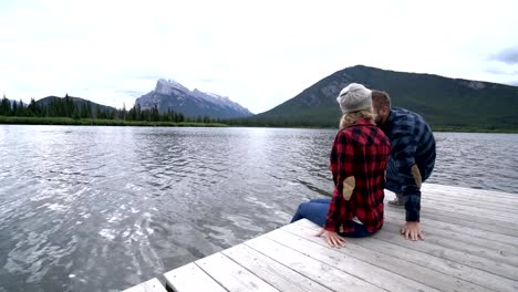 Two-young-adults-enjoying-nature-by-the-lake