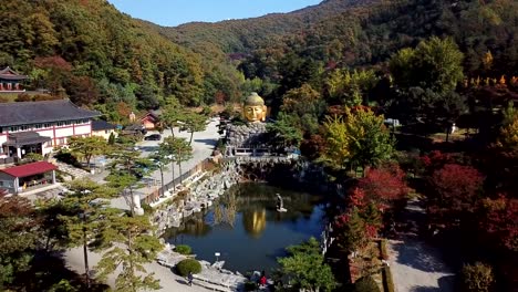 Aerial-view-autumn-of-Statue-of-Buddha-in-Wawoo-Temple,-Yong-in,-Korea