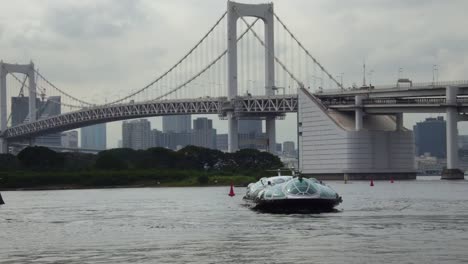 Tokyo-city-cityscape-view-with-iconic-bridge-and-modern-Hikimo-hotaluna-boat