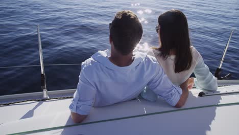 Young-couple-on-sailboat-together.