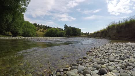 Man-fly-fishing-on-the-Mataura-River-in-southland-region-of-the-South-Island-of-New-Zealand