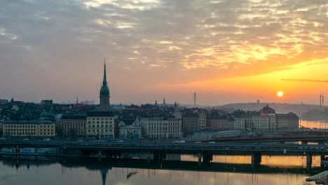 Stockholm-city-skyline-night-to-day-sunrise-timelapse-at-Gamla-Stan-and-Slussen,-Stockholm-Sweden-4K-Time-Lapse