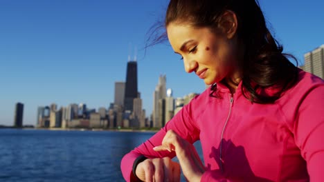 Hispanic-Caucasian-female-outdoors-doing-cardio-warm-up