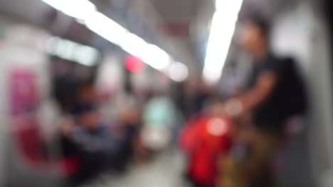 Travelers-passengers-in-airport-transit-terminal-walking-with-luggage-baggage-going-traveling.-Business-travel-people-out-of-focus-and-blurry-in-background-:-4k