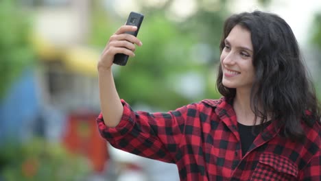 Young-beautiful-businesswoman-taking-selfie-outdoors