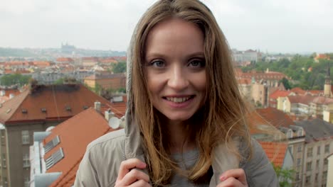 view-from-top-on-a-cozy-Prague-streets-in-cloudy-summer-day,-camera-is-turning-to-cheerful-woman