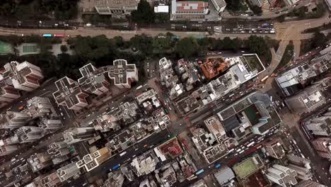 Cars-with-intersection-streets-in-Sham-Shui-Po-district-on-top.-City-roads.-Architecture-and-transportation-background.-Aerial-view-of-buildings-in-Hong-Kong