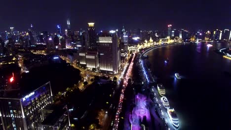 AERIAL-shot-of-ship-running-on-Huangpu-River-at-night/Shanghai,China