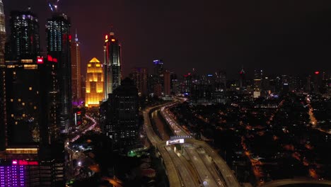 night-illuminated-kuala-lumpur-downtown-traffic-road-aerial-panorama-4k-malaysia