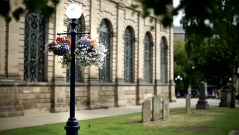 Hanging-flower-basket-outside-St-Philip's-Cathedral,-Birmingham.