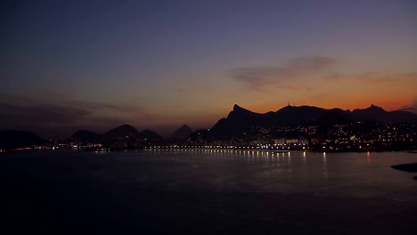 Low-angle-aerial-view-of-Rio-de-Janeiro-Bay-at-Dusk,-Brazil