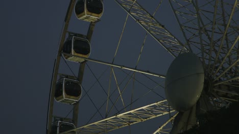 Locked-on-shot-of-Ferris-wheel-at-night