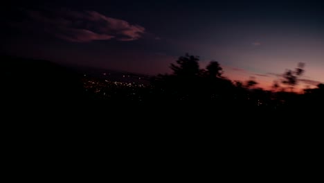 View-from-car-window-of-city-in-sunrise