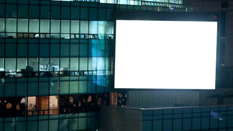 Timelapse-of-blinking-blank-screen-on-office-building-at-night.-Seoul,-South-Korea