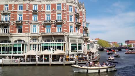 Two-speedboats-passing-by-the-hotel-building