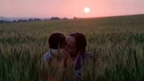 young-Asian-family-in-a-field-with-a-baby-1-year-on-hand,-the-concept-of-family-happiness,-beautiful-sunlight,-sunset,-slow-motion