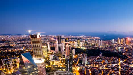 Pan-shot-Timelapse-rooftop-view-of-Istanbul-cityscape-and-Golden-horn-at-night