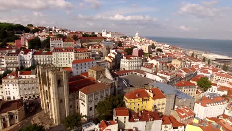 Aerial-view-of-historical-part-of-Lisbon-and-Lisbon-Cathedral-at-sunny-day-Portugal