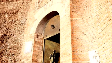 close-up-on-bronze-statues-on-a-door-of-a-church,-Rome