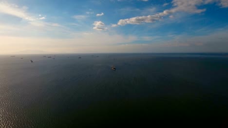 Aerial-Cargo-ships-anchored-in-the-sea.-Philippines,-Manila