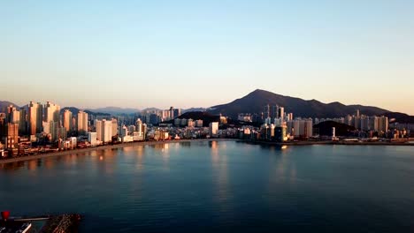 Gwangan-Bridge-and-Haeundae-aerial-view-at-Sunrise,-Busan,-South-Korea.