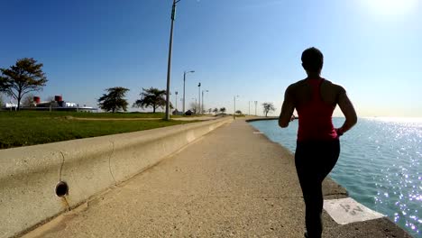 African-American-female-running-by-Chicago-city-shoreline