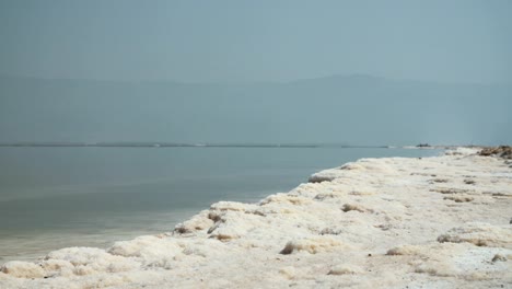 Tracking-shot-of-salt-deposits-on-the-banks-of-the-Dead-Sea-in-israel