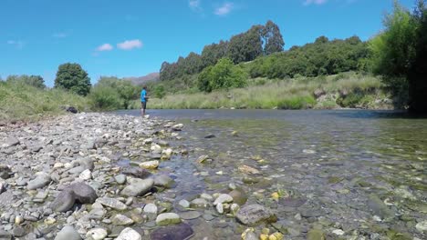 Man-fly-fishing-on-the-Mataura-River-in-southland-region-of-the-South-Island-of-New-Zealand