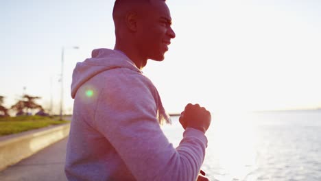 African-American-male-in-sun-flare-exercising-outdoors
