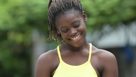 Young-happy-African-woman-outdoors