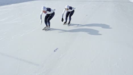 Determined-Athletes-Skating-on-Ice-Rink