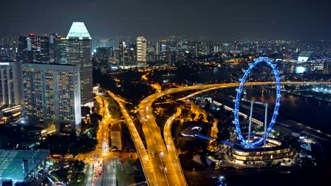 Singapore-Flyer,-the-ferris-wheel,-and-skyscraper-buildings-in-financial-district,-downtown-Singapore-City