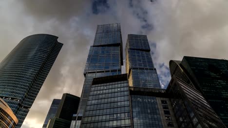 bottom-up-view-of-rotating-skyscrapers-and-flying-clouds,time-lapse,-hyper-lapse