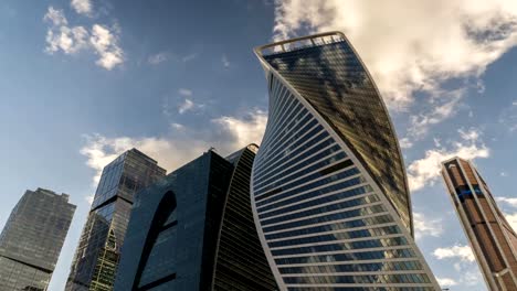 bottom-up-view-of-rotating-skyscrapers-and-flying-clouds,time-lapse,-hyper-lapse