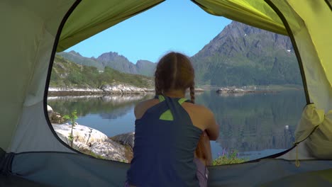 Happy-girl-sitting-in-a-tent