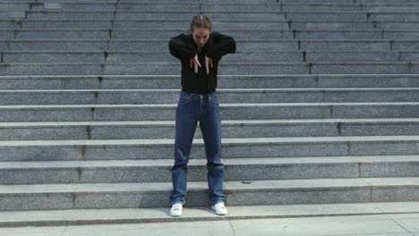 Young-Woman-on-Exterior-Stairway-of-a-Building-in-Various-Dance-Poses