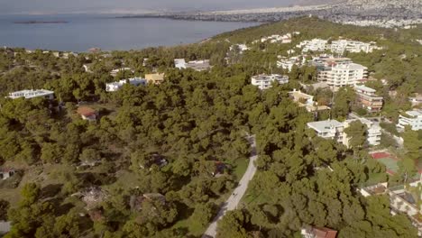 Aerial-view-of-relaxing-residential-area-located-at-seaside-in-Greece.