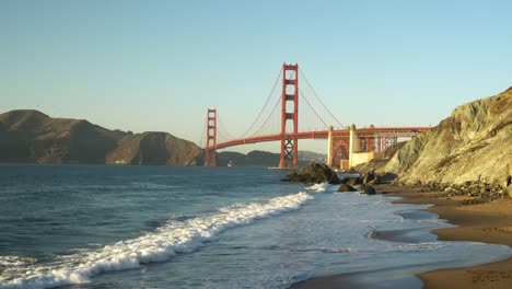 sunset-zoom-in-view-of-golden-gate-bridge-from-marshall-beach-in-san-francisco