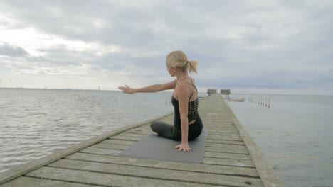 Girl-making-yoga-pose-on-bridge