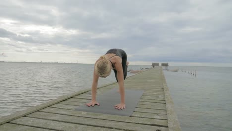 Girl-making-yoga-pose-on-bridge