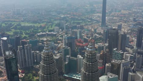 sunny-day-kuala-lumpur-city-downtown-famous-towers-tops-aerial-panorama-4k-malaysia